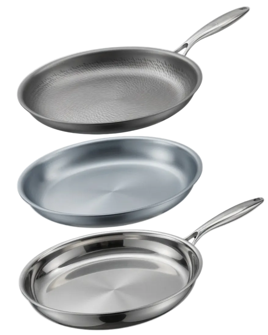 Three stainless steel frying pans of different sizes stacked vertically on a plain white background, showing different finishes: textured titanium, aluminium, and polished stainless steel.